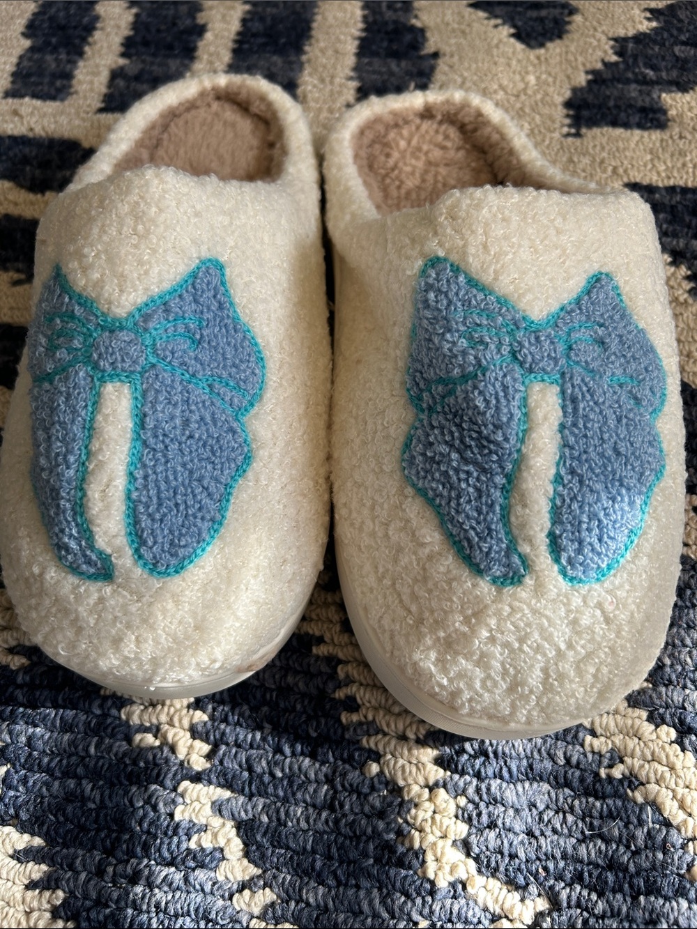 Kids Cozy Cream Slip-On Slippers with Blue Bow Accent